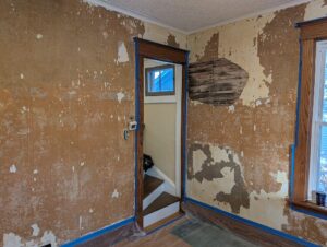 before image of plaster wall damage